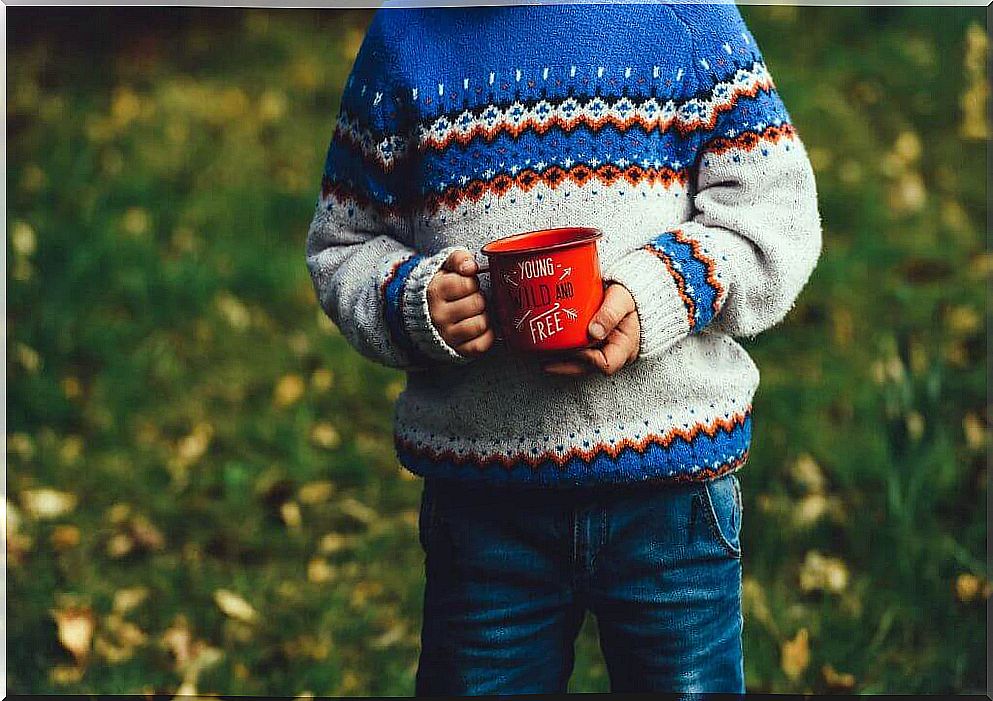 Child with cup in his hands