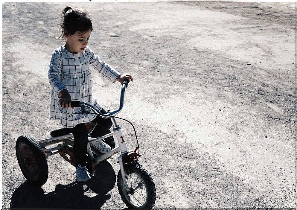 Little girl on a bicycle