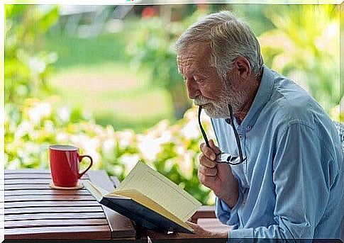 Elderly man reading.