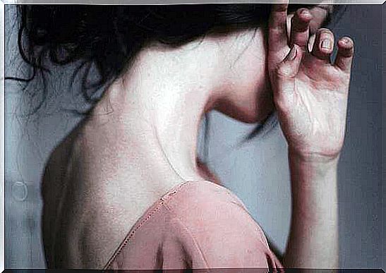 woman covering her face