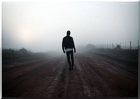 Man walks in the fog