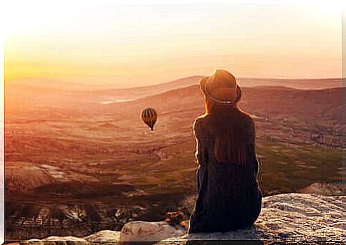 Woman watching a hot air balloon