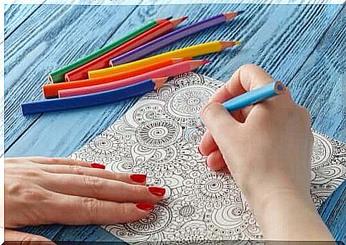 Person coloring a mandala.