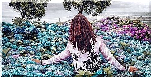 Woman walking among the flowers