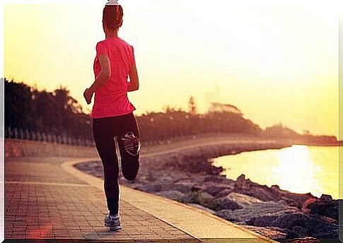 Girl runs in the morning near the sea