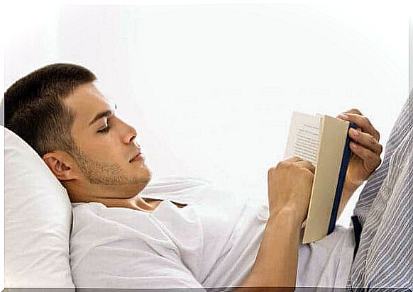 Boy reading in bed