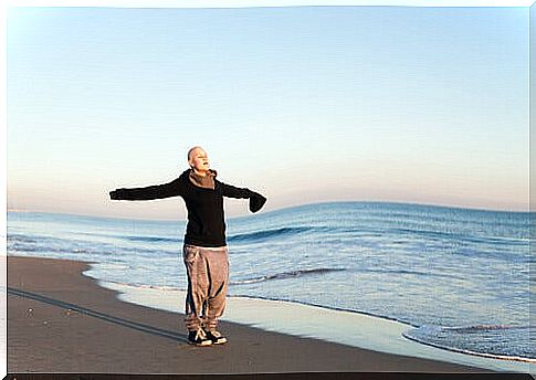 Woman with breast cancer at the beach