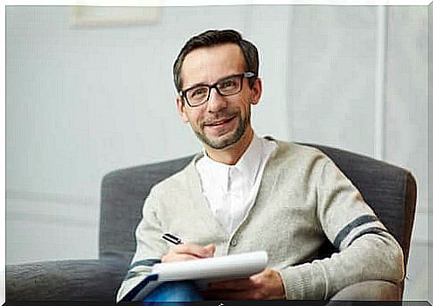 Psychologist taking notes during a therapy session.