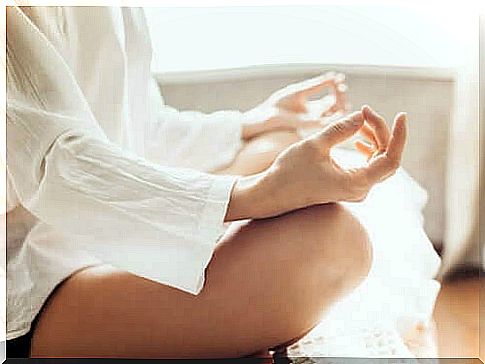 Woman meditating at home.