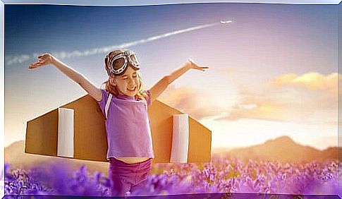 little girl playing in a lavender field